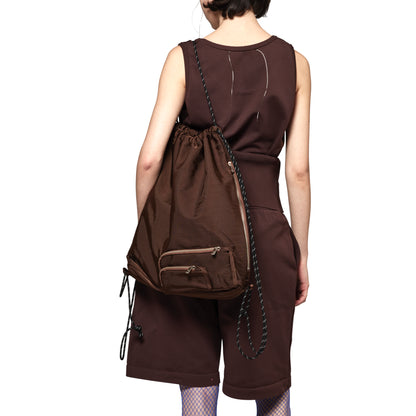 SPACE SUIT KNAPSACK in brown by AYA. Unisex bag made in Japan.